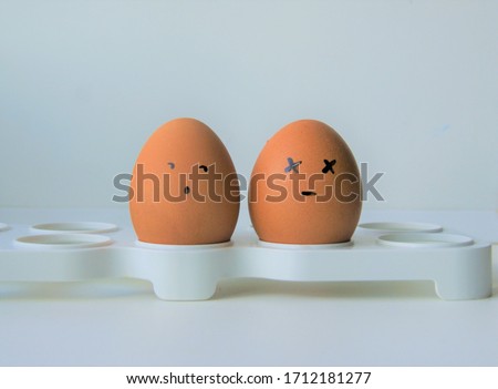 Two sad faced boiled eggs 