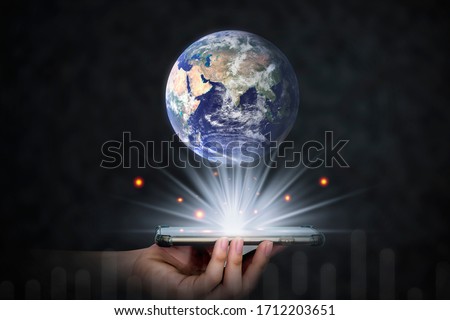 Earth and smart phone represent e-learning online in the digital age Knowledge education. Earth day. Energy saving and Learning concept, Elements of this image furnished by NASA