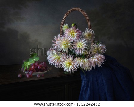 Still life with bouquet of pink dahlia in basket