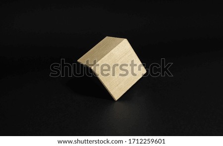 Single wooden cube on isolated on black background.