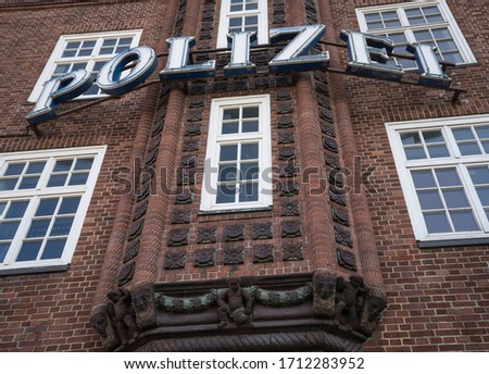 Police station sign on a historic german building.