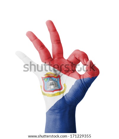 Hand making Ok sign, Sint Maarten (Neth.) flag painted as symbol of best quality, positivity and success - isolated on white background