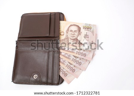 Thai currency banknote, Five Thousand baht in old wallet on white background, Money for heal people from situation in Thailand, Economic downturn 