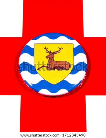 A badge portraying the flag of the English county of Hertfordshire pictured over the England flag.