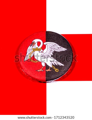 A badge portraying the flag of the English county of Buckinghamshire pictured over the England flag.