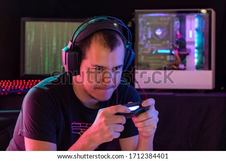Expression session. Young man playing videogames with different facial expressions