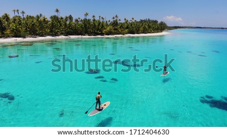 Paddle board Lagoon in French Polynesia Royalty-Free Stock Photo #1712404630