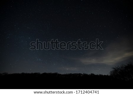 Stars At Night In Dark Sky  Royalty-Free Stock Photo #1712404741