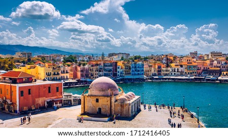 Mosque in the old Venetian harbor of Chania town on Crete island, Greece. Old mosque in Chania. Janissaries or Kioutsouk Hassan Mosque in Chania Crete. Turkish mosque in Chania bay. Crete, Greece. Royalty-Free Stock Photo #1712416405