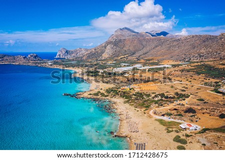 Aerial shot of beautiful turquoise beach Falasarna (Falassarna) in Crete, Greece. View of famous paradise sandy deep turquoise beach of Falasarna (Falassarna) in North West, Crete island, Greece. Royalty-Free Stock Photo #1712428675