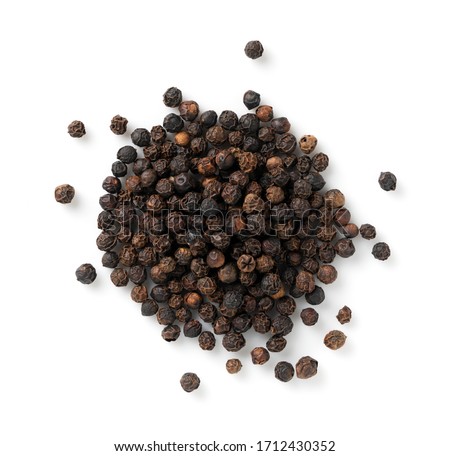 Black pepper placed on a white background Royalty-Free Stock Photo #1712430352
