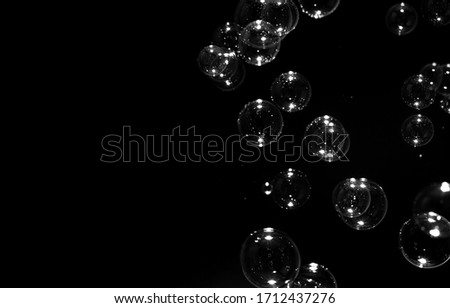 transparent bubbles floating on the dark, bubbles abstract background, black background