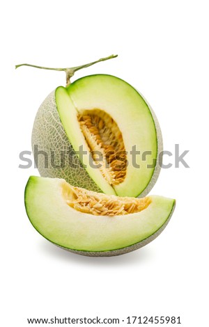 Organic japanese honeydew melon and a half on white isolated background with clipping path. Ripe green cantaloup melon have sweet taste and juicy for refreshing in summer. Fresh fruit concept. Royalty-Free Stock Photo #1712455981