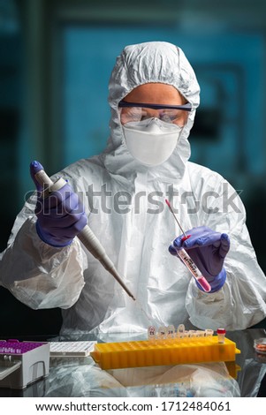 Female health worker performing coronavirus testing in the lab Royalty-Free Stock Photo #1712484061
