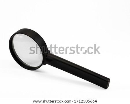 Close up of magnifying glass, isolated on white background, with clipping path