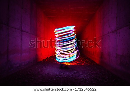 colored led lights to a cylinder light painting Royalty-Free Stock Photo #1712545522