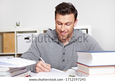 Student learns with many books at the desk