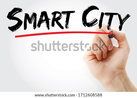 Smart city - technologically modern urban area that uses different types of electronic methods and sensors to collect specific data, text concept with marker