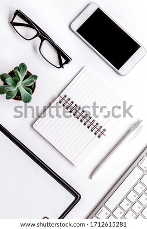 modern flat lay with office items on white desk background top view mockup