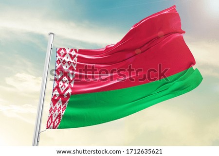 Belarus national flag cloth fabric waving on the sky with beautiful sky - Image