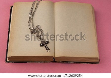 Close up cross and open bible book