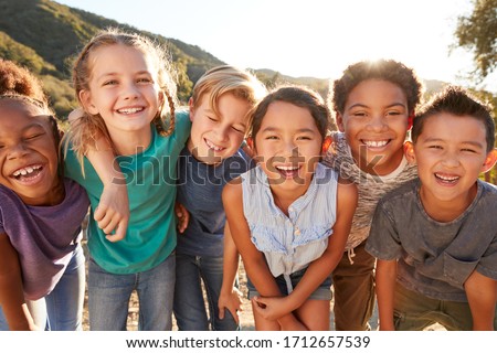Portrait Of Multi-Cultural Children Hanging Out With Friends In The Countryside Together Royalty-Free Stock Photo #1712657539