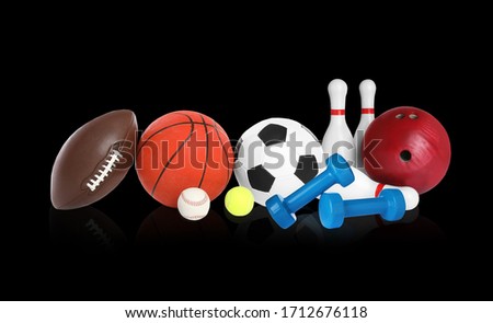 Set of different sport equipment on black background