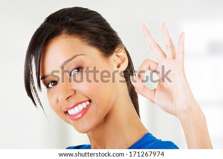 Happy student girl gesturing perfect