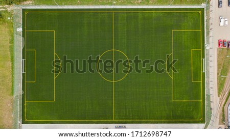Aerial photo of empty astroturf / football field Royalty-Free Stock Photo #1712698747