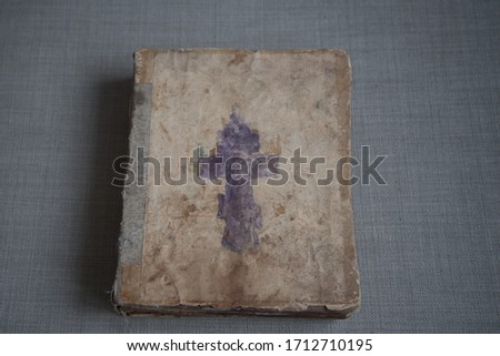 A very old Bible that has survived to this day. Photo of the book on top.