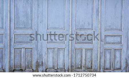 Gray old doors, part of a traditional Javanese house