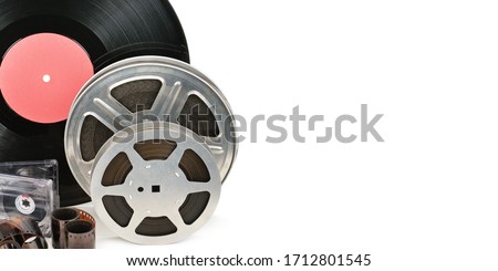 Vinyl record, video and audio cassettes isolated on white background. Retro equipment. Free space for text. Wide photo .