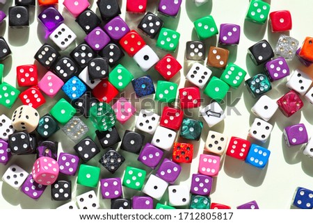 Playing dice at white wooden background. Playing a game with dice. Rolling the dice concept for business risk. Risk concept.