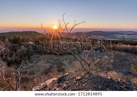 Colorful sunset in the old quarry  in the Orlické Mountains, Czechia