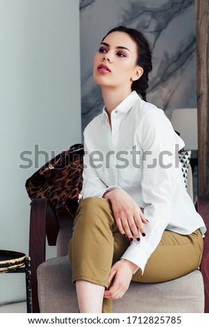 pretty stylish woman in fashion dress with leopard print in luxury house interior, lifestyle people concept