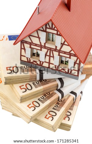 half-timbered house on euro banknotes, symbolic photo for home purchase, financing, building society