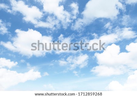 Beautiful sunny blue sky background with wispy fluffy white cumulus & cirrus clouds on exotic horizon in tropical summer or spring morning sunlight & sun rays at daylight sunny & sunshine day, space