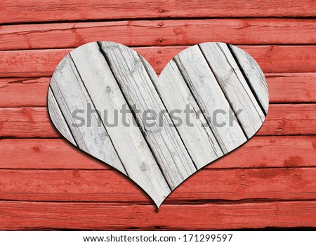 Heart carved on a wooden surface. The concept of Valentine's Day