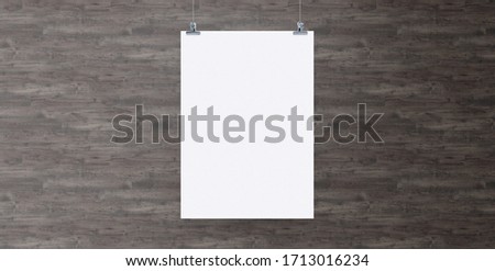 Blank white paper hanging on brick wall. Poster clips empty template mockup.