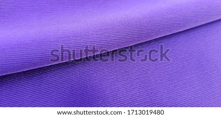 Purple synthetic fabric (diagonal fold; texture).