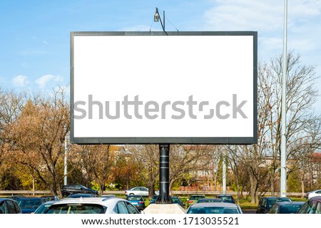 Blank white advertising display device on the car park