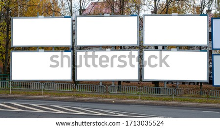 Six blank white advertising billboards in the city