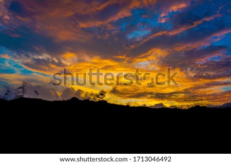 
sunset behind the mountain, sunset is a beautiful view