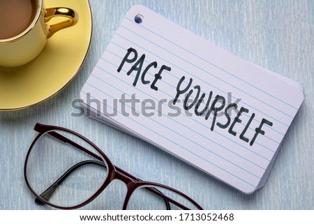 pace yourself reminder  - handwriting on index card with a cup of coffee, business and lifestyle concept Royalty-Free Stock Photo #1713052468