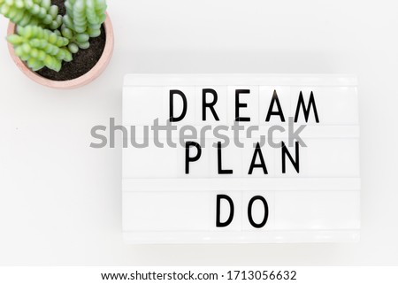 Lightbox with motivating words Dream. Plan. Do. Motivation background