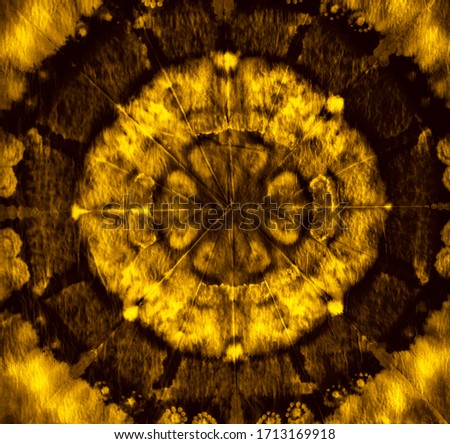 Dirty art abstract brown gold background Ethnic folk pattern. Bright yellow design. with ikat pattern. Old manuscript Fragment of artwork. Spots of acrylic paint.