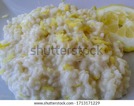 Lemon risotto background on white plate