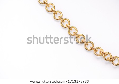 Seamless golden metal chain isolated on white background