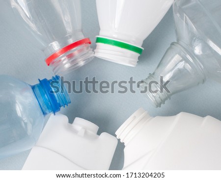 Plastic, close-up bottles, white colored transparent. The concept is the environment, sort of garbage, clean world. Copy space.