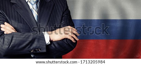 Male hands against russian flag background, business, politics and education in Russia concept